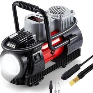 The HORUSDY Portable Air Compressor with LED Light features a digital display, carrying handle, built-in light, and various nozzle attachments.